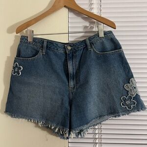 Blue denim shorts with flowers